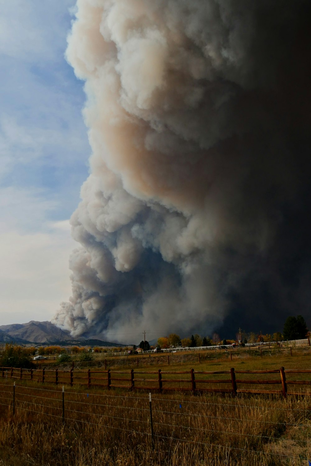 white smoke coming out from a factory