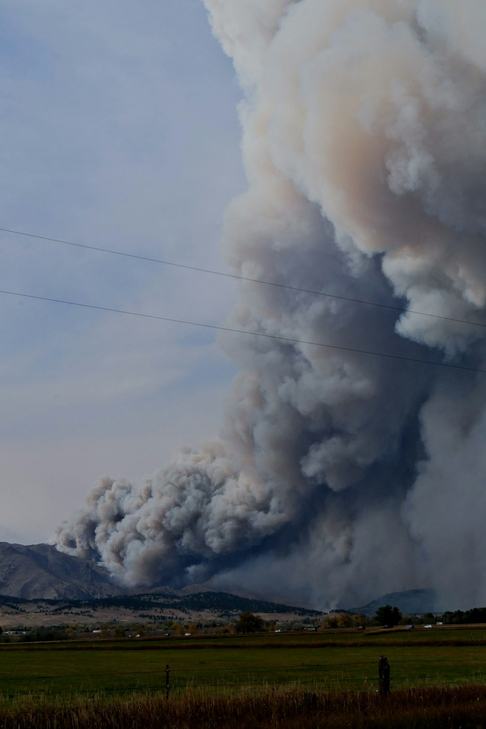 white smoke coming out from the sky