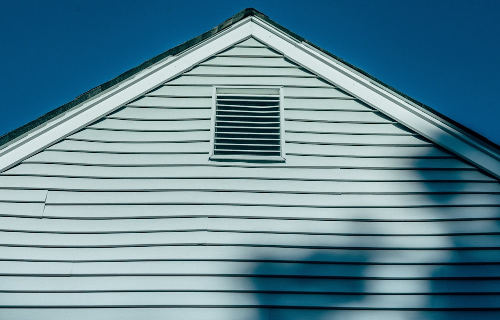 white wooden house under blue sky during daytime