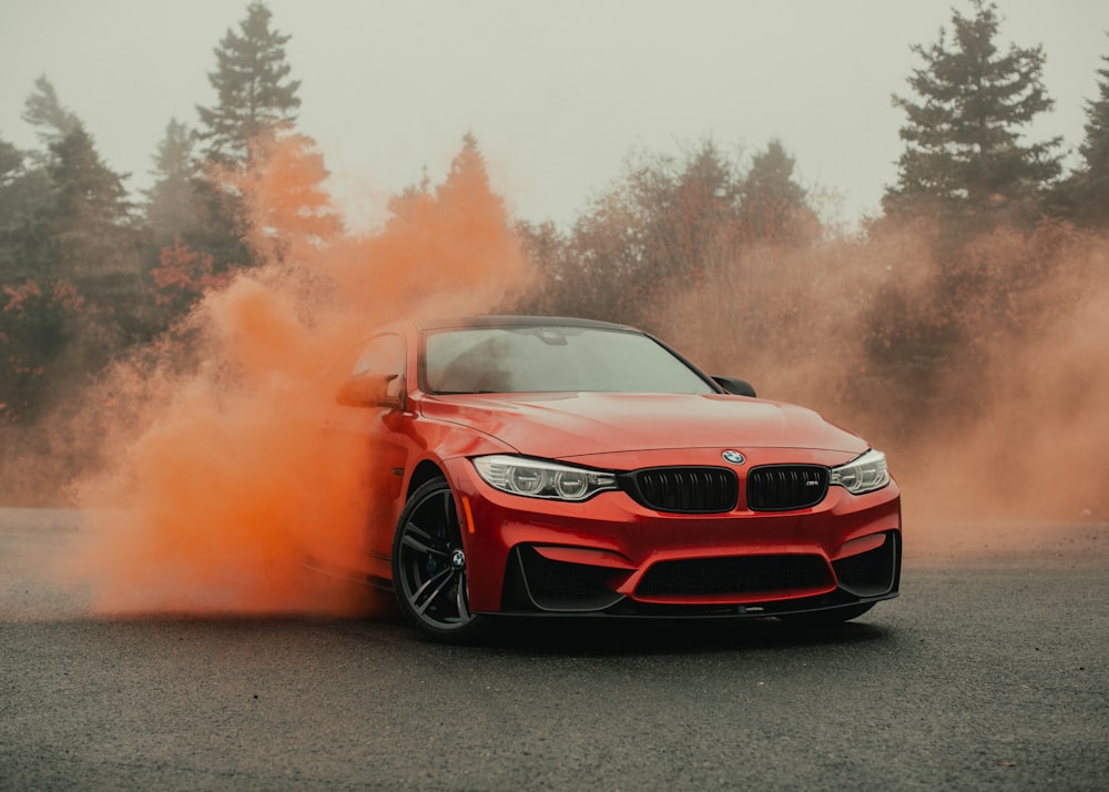 red bmw m 3 on road