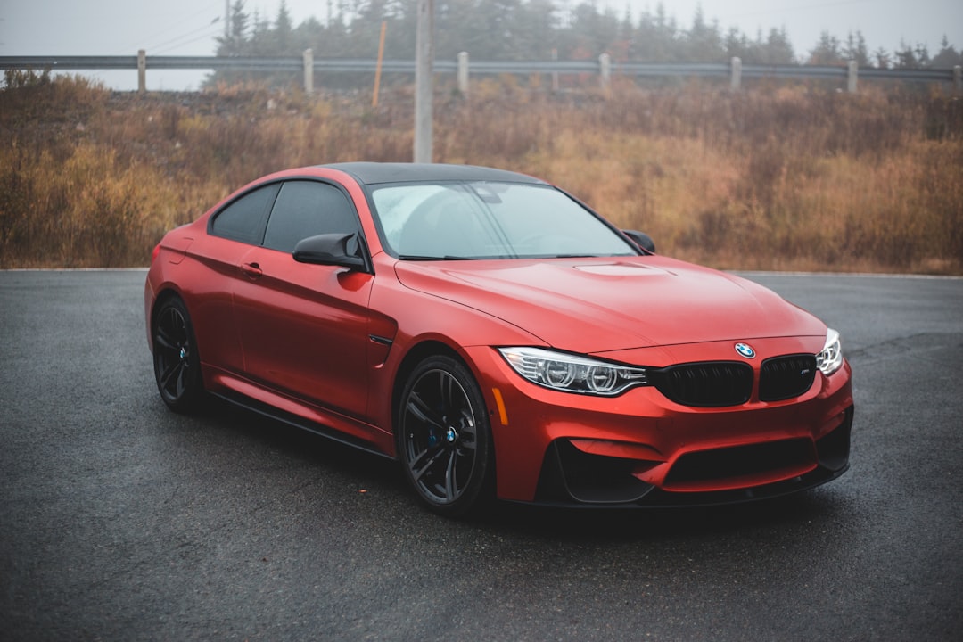 red bmw m 3 coupe on road during daytime