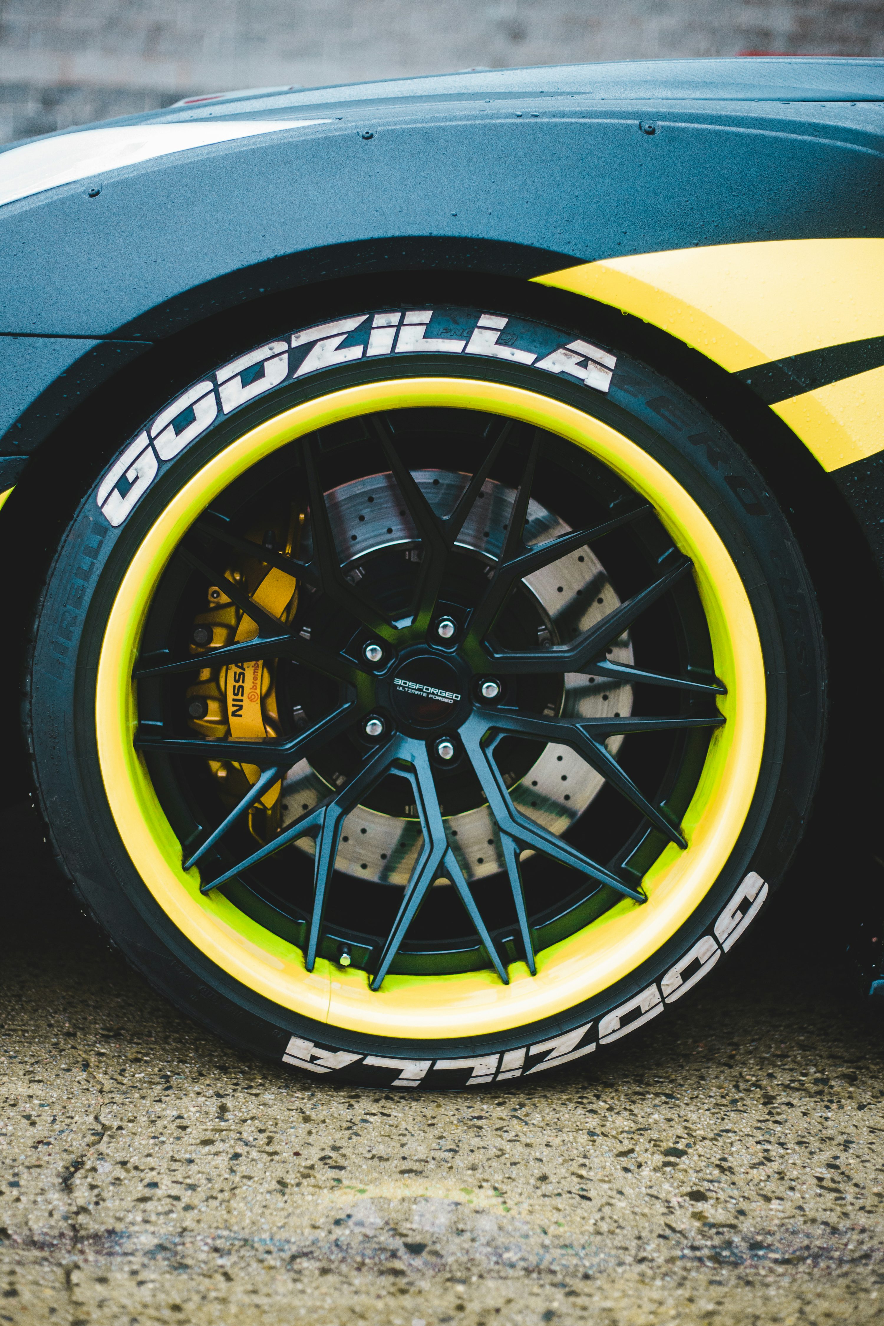 black and yellow wheel with tire