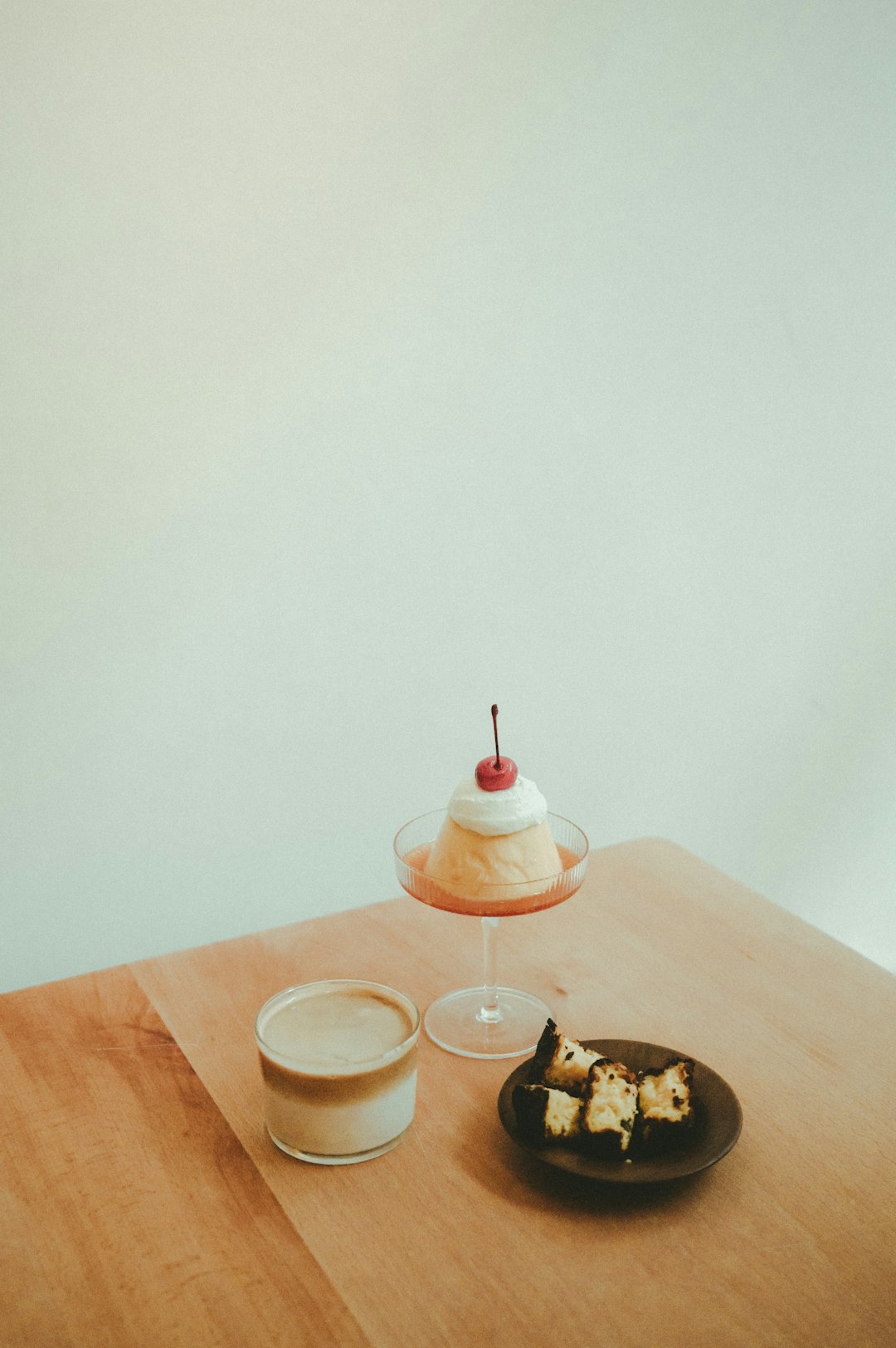 clear drinking glass on brown wooden table