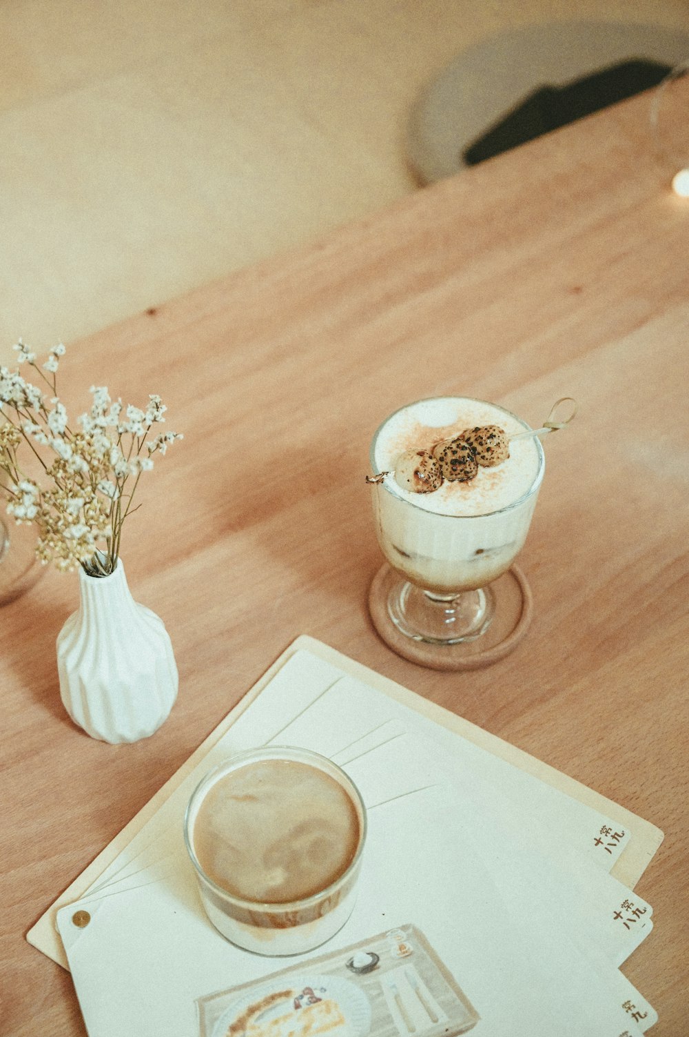 clear glass cup with white liquid inside