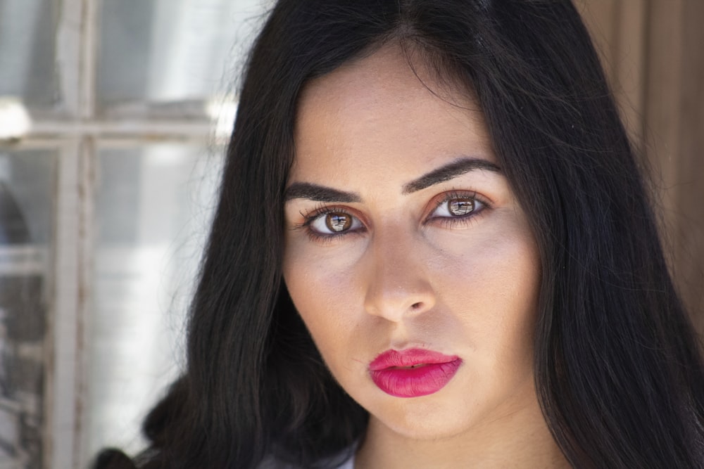 woman with red lipstick and black hair