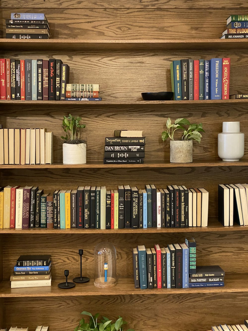 books on brown wooden shelf