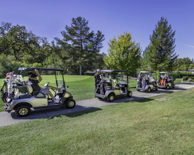 several white golf carts on cart path in Florida during daytime