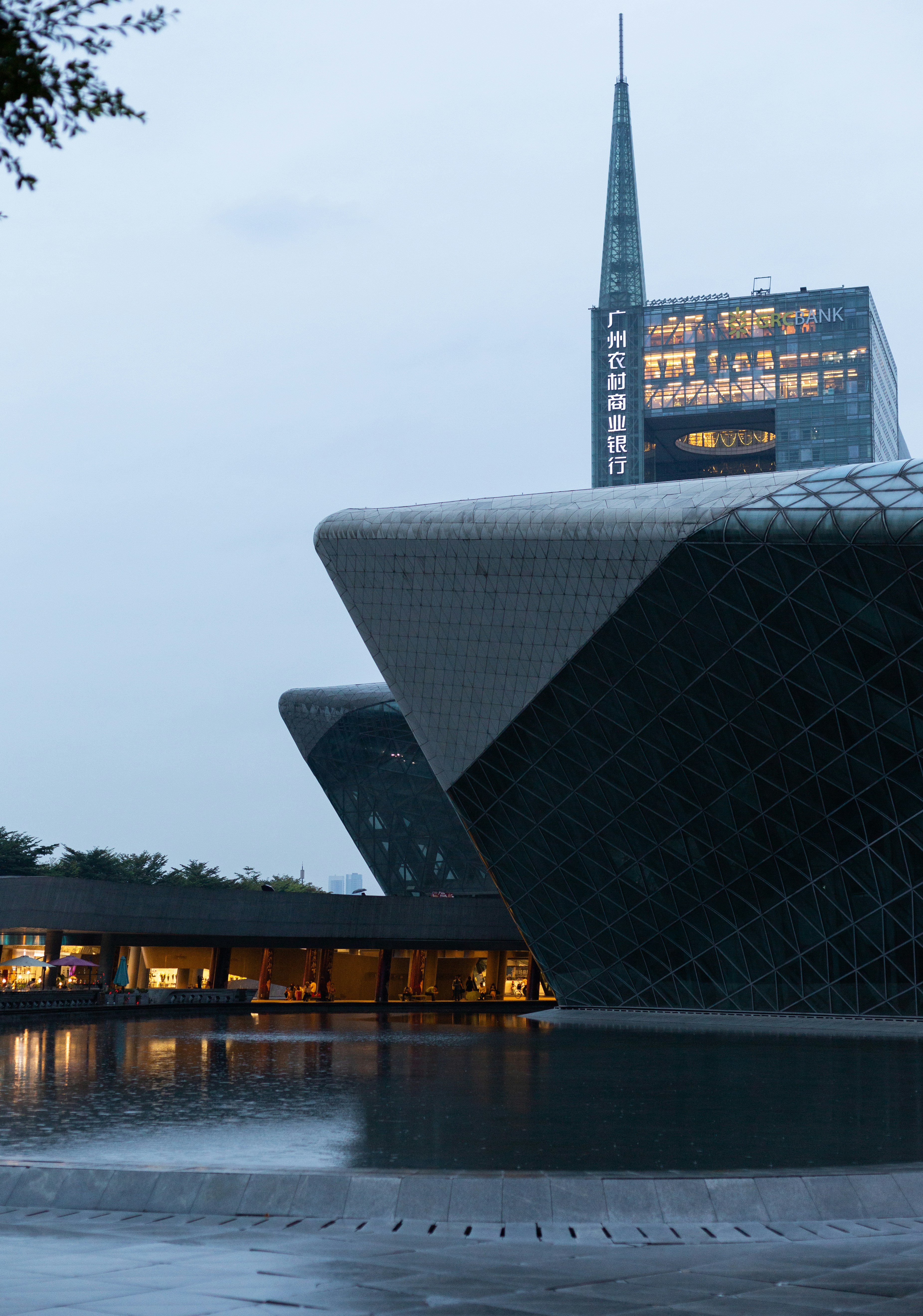 black and white concrete building near body of water during daytime