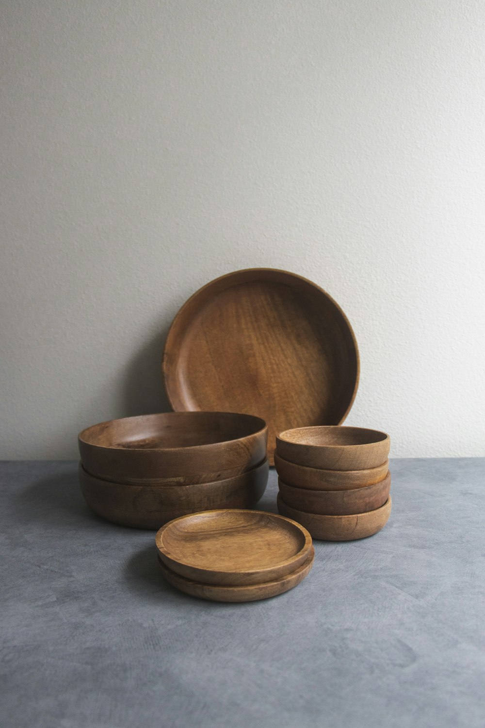 brown wooden round bowl on white table