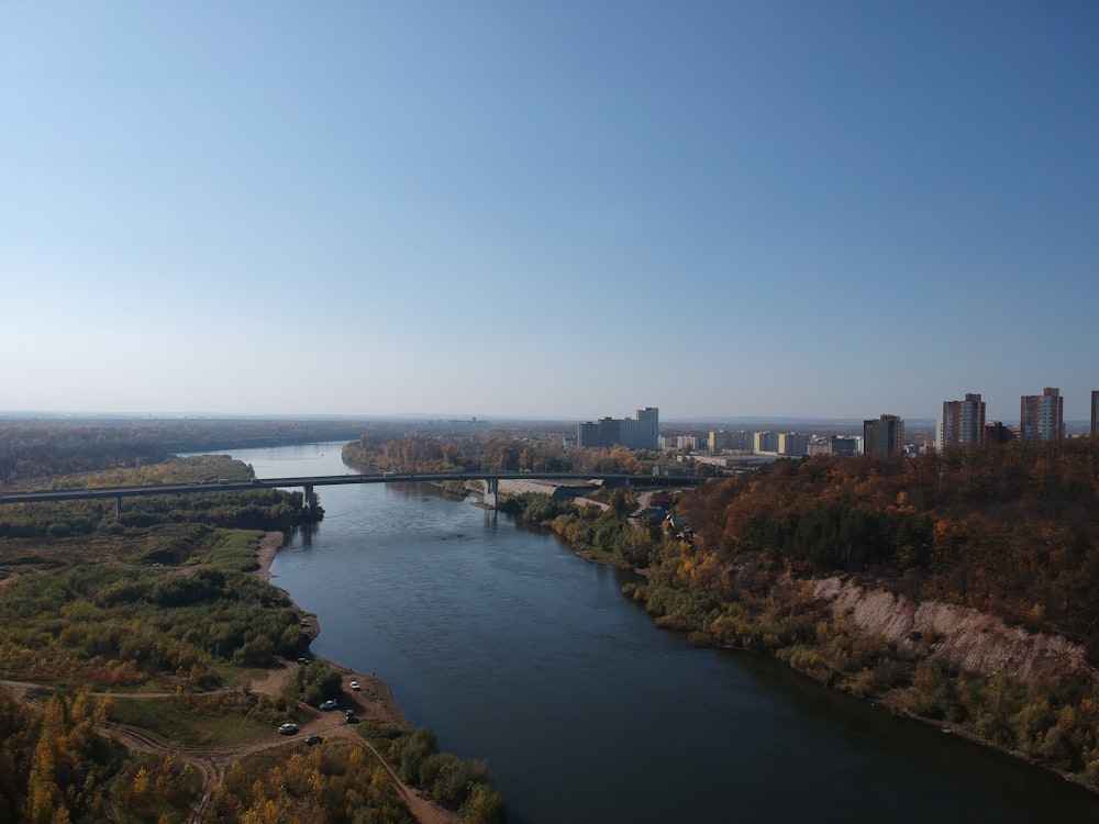 body of water near city buildings during daytime