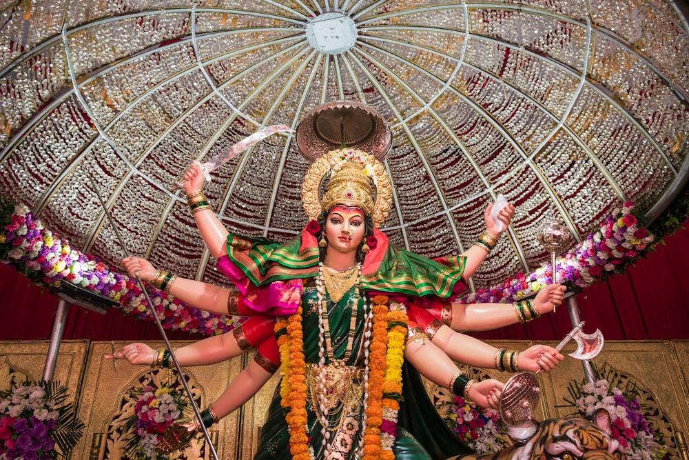 woman in green and gold traditional dress