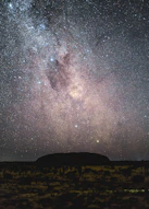 silhouette of mountain under starry night