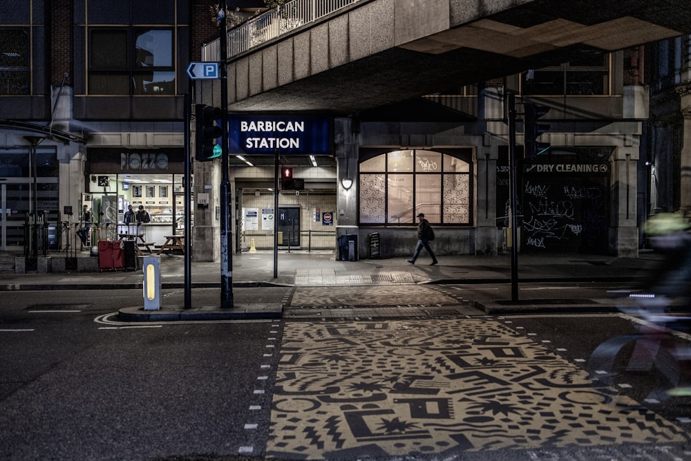 black metal stand near brown and white building