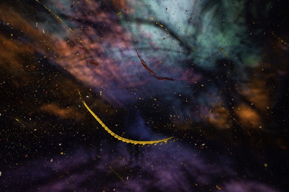Abstract visual with a cosmic feel, featuring a blend of swirling colors including blue, purple, and orange. Thin, curved, yellow lines cut across the dark, starry background, resembling deep space or a nebula.