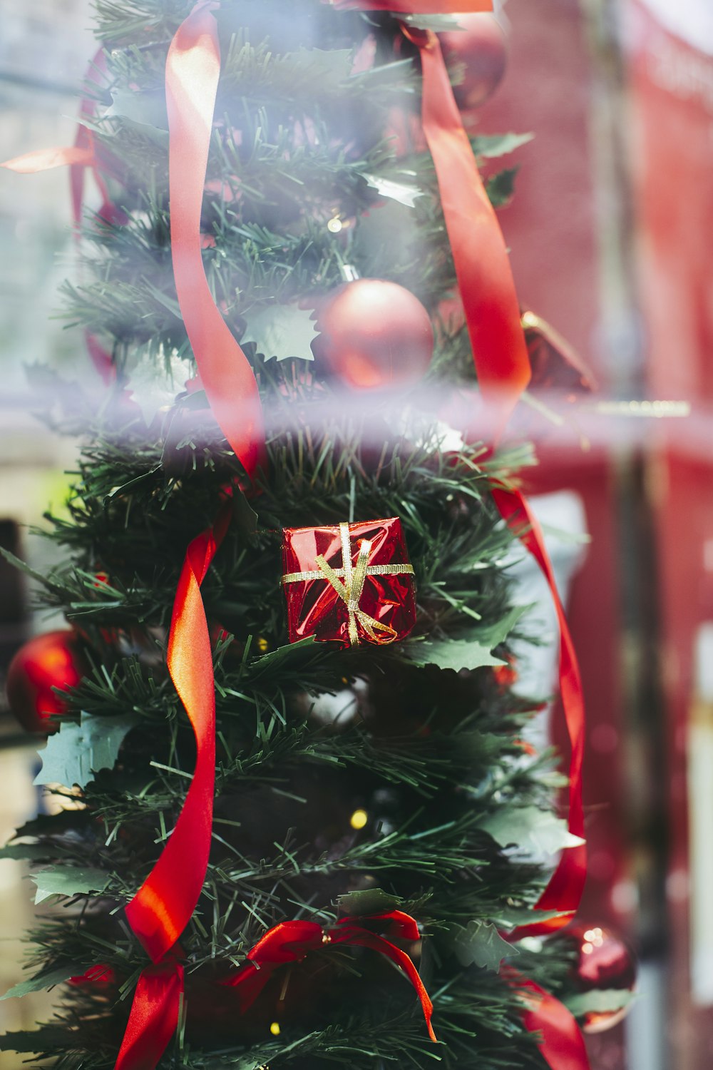 red and white christmas tree with baubles