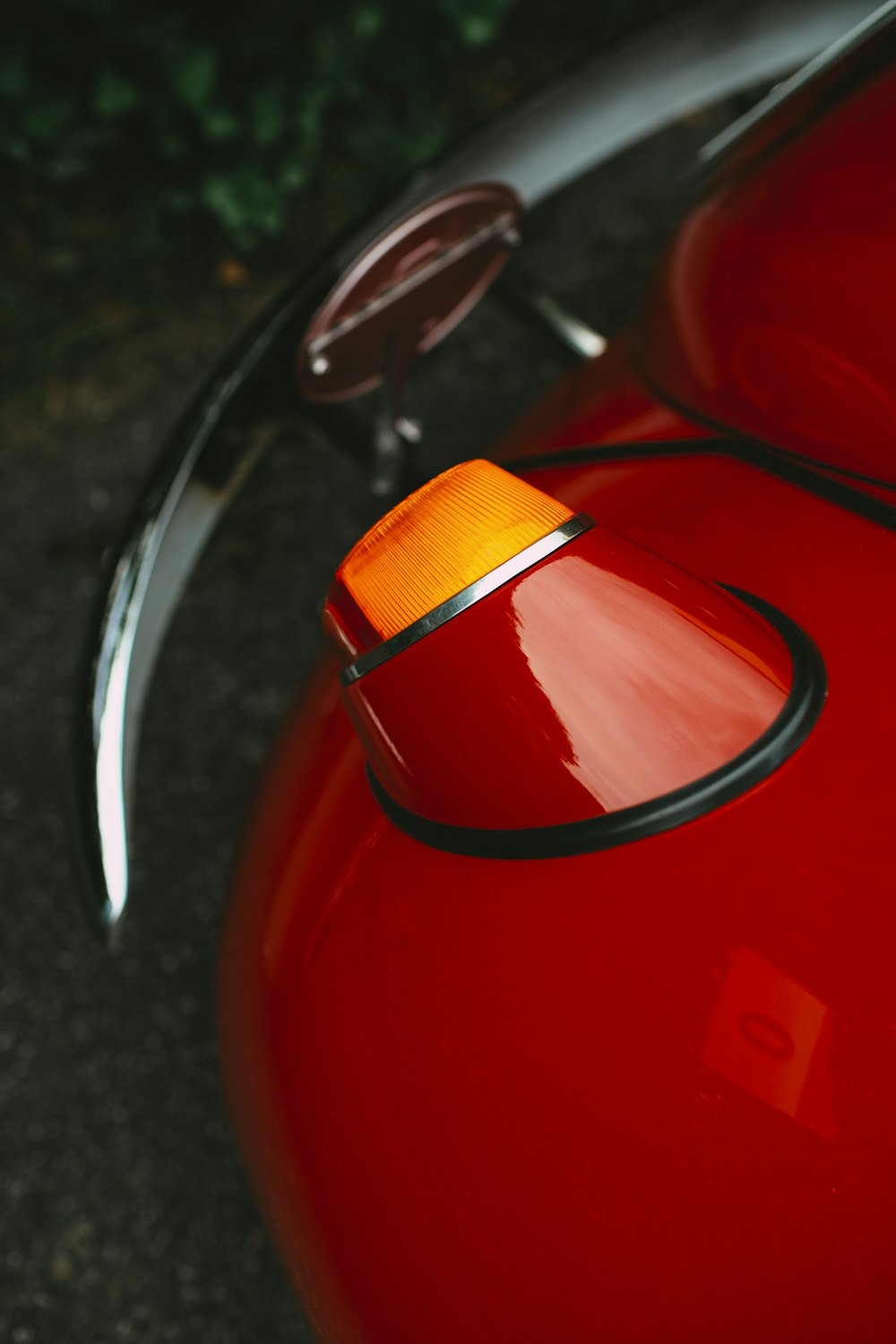 red and silver car side mirror