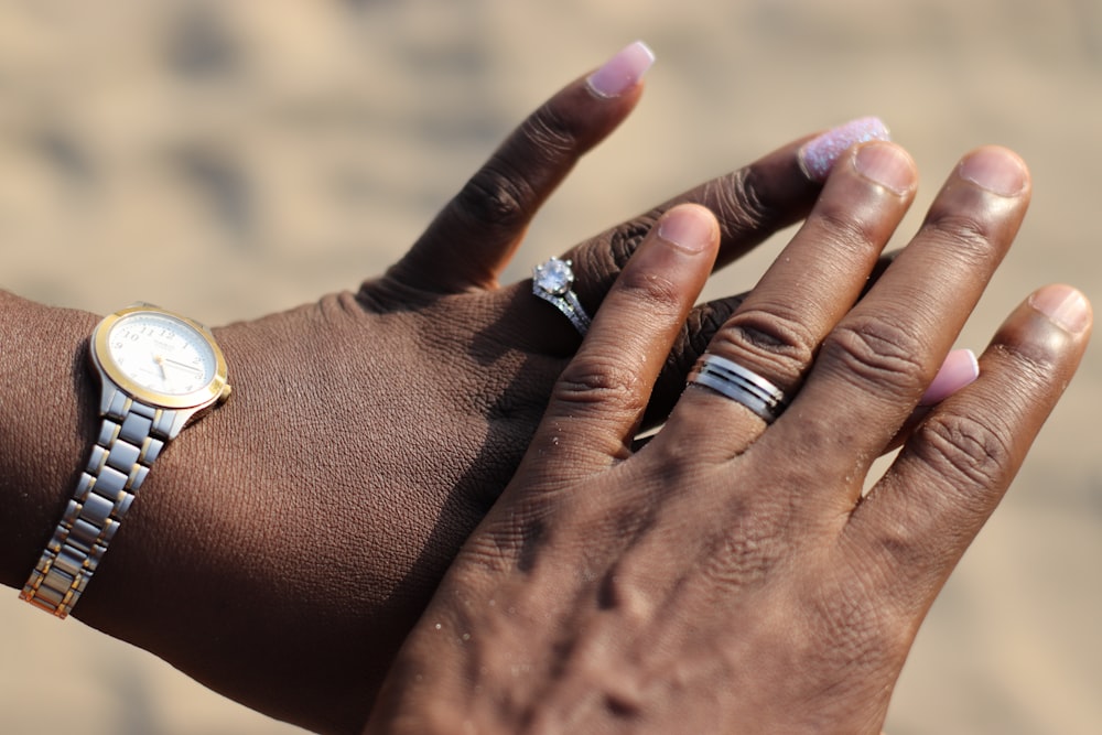 person wearing gold and silver ring