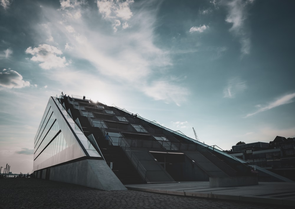 black and white building under blue sky