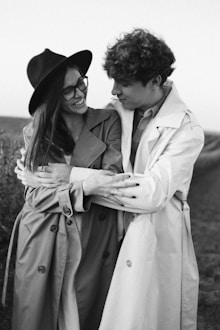 man and woman in gray coat and black hat