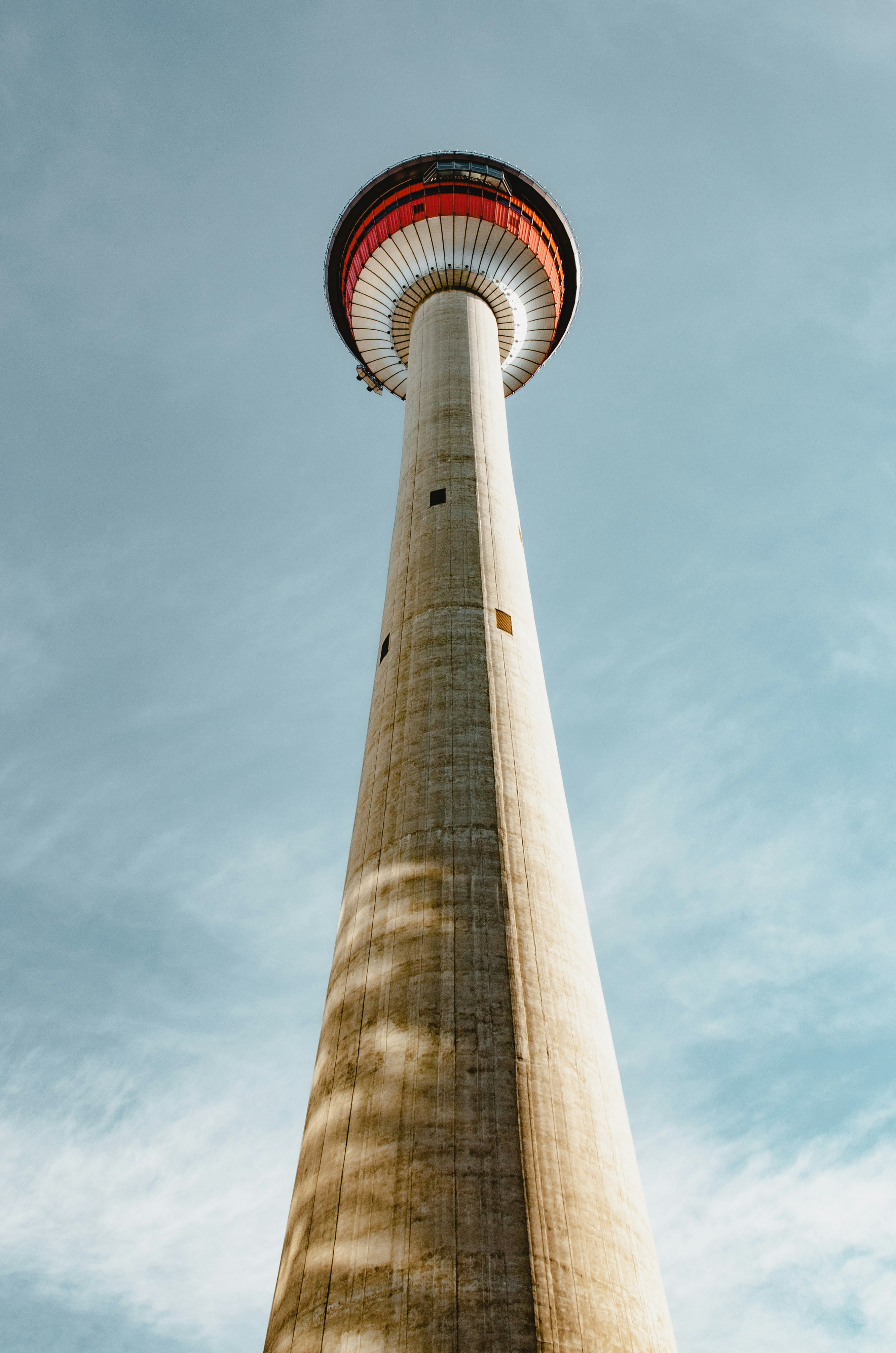 white and red tower under blue sky