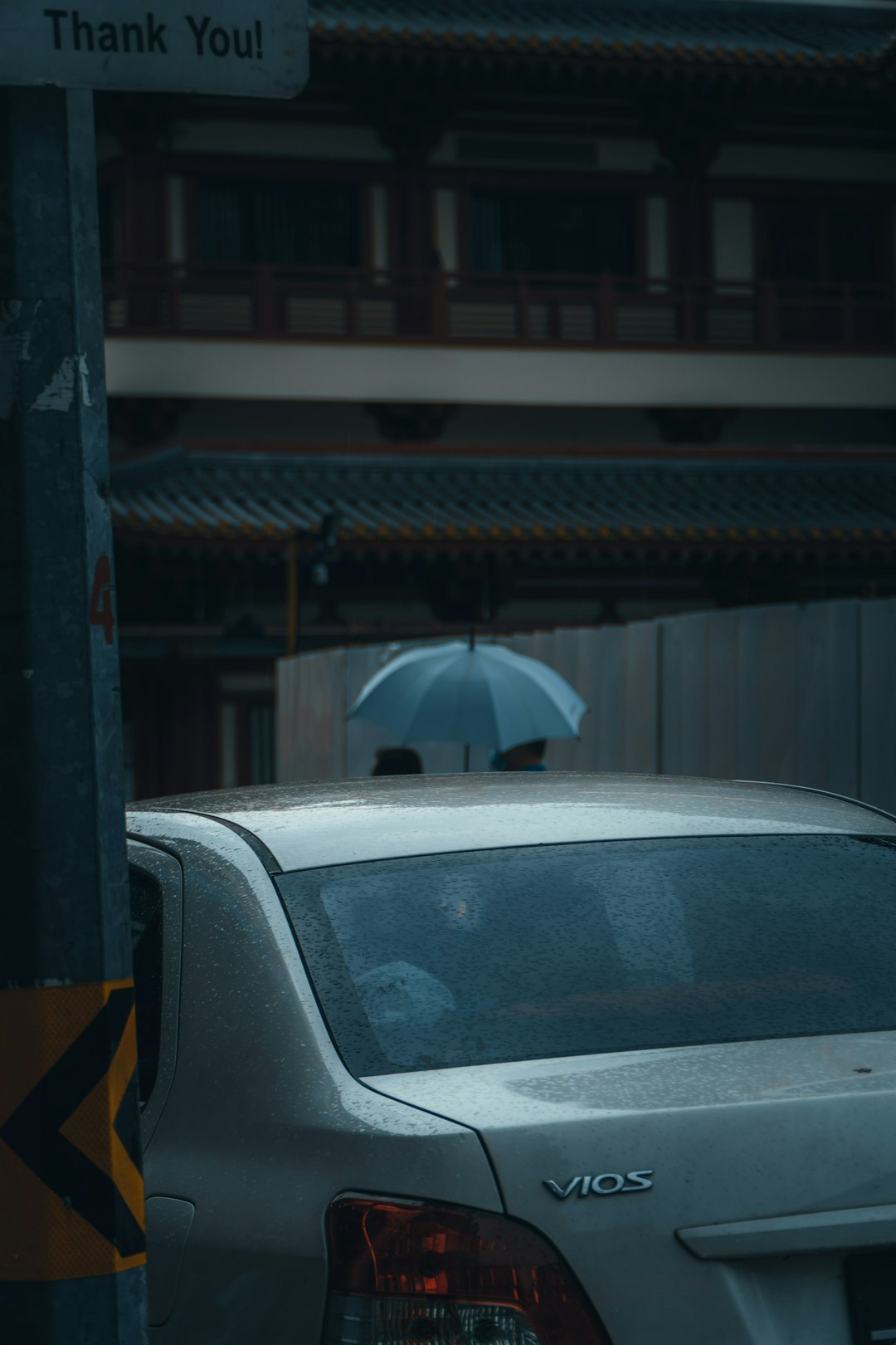 black car parked near building