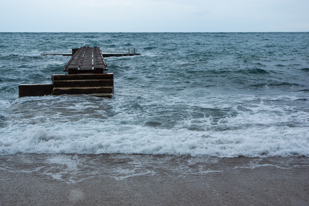 brown wooden dock on sea during daytime