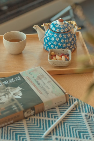A cozy setup featuring a cup of tea and delicious snacks.