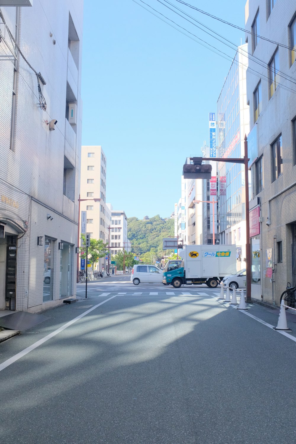 blue and white bus on road during daytime