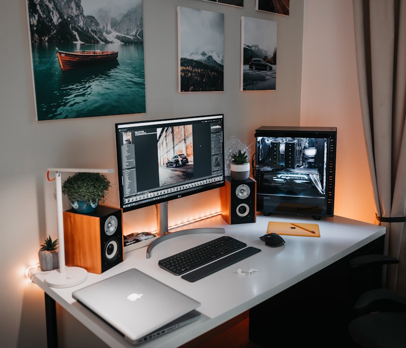 macbook pro on brown wooden desk