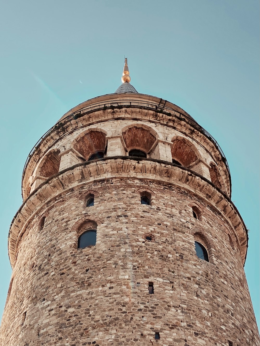 brown concrete building under blue sky during daytime