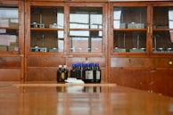 Scientific kits including magnetism and physics sets displayed on a wooden table.