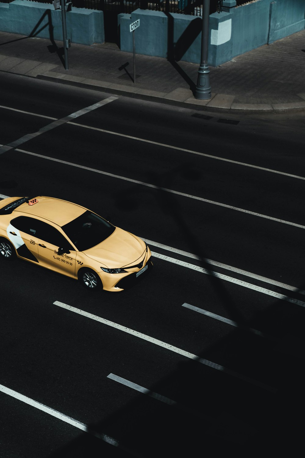 yellow car on the road