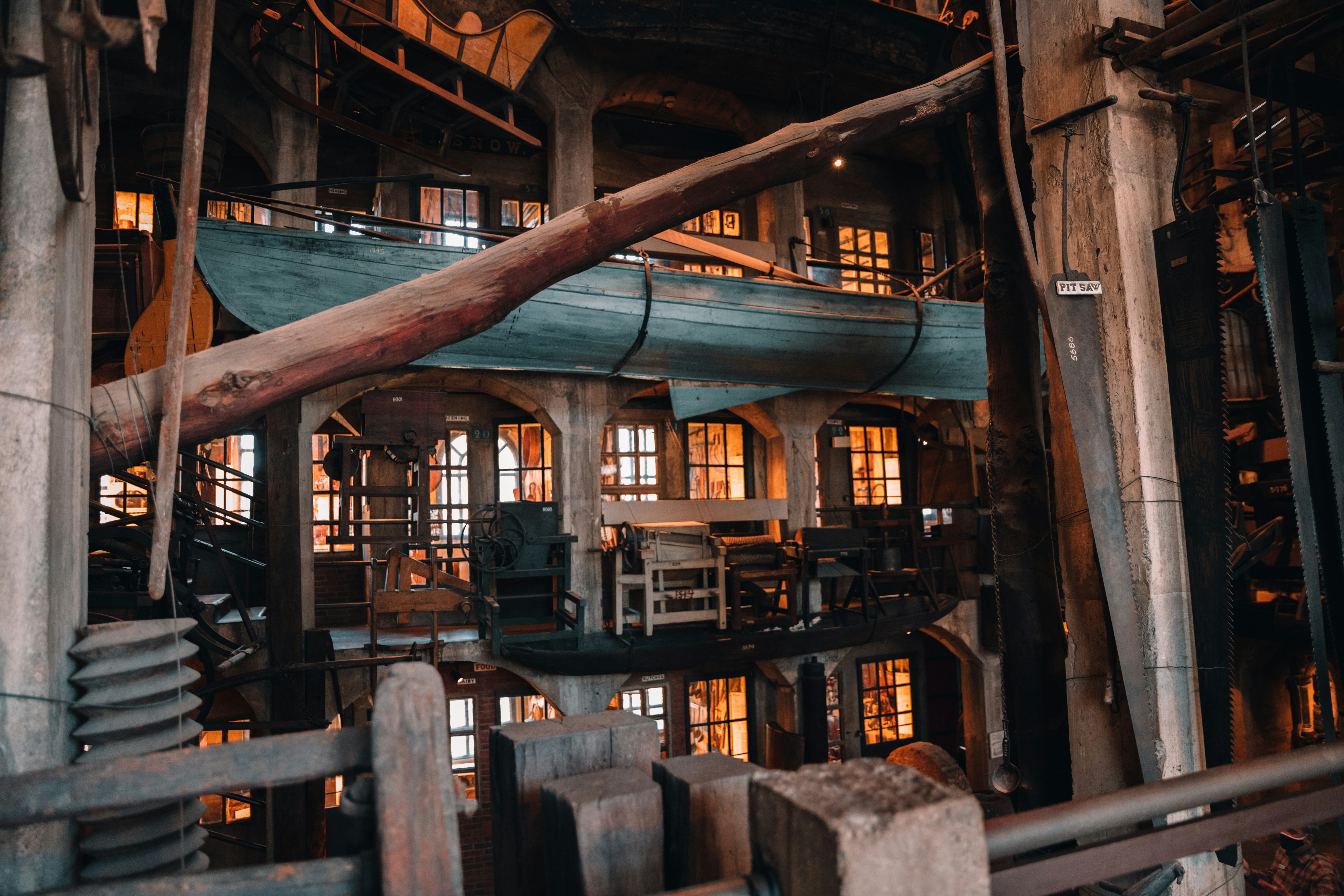 Brown wooden bridge over water at heritage distillery