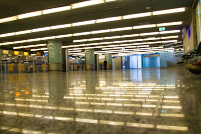 A panoramic view of the central supply point bustling with activity under warm lighting.