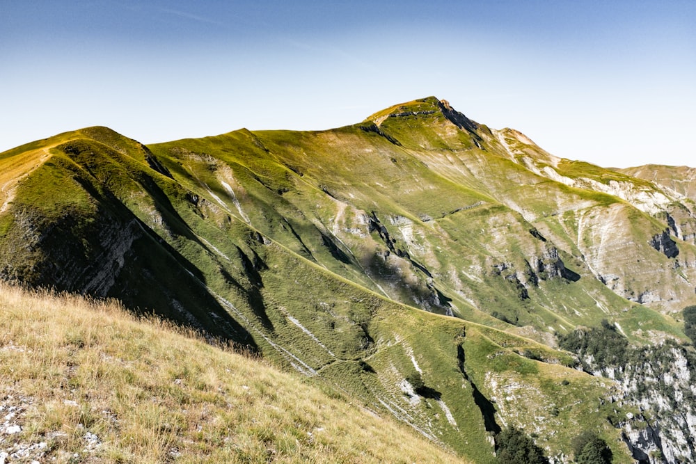 green and brown mountain under blue sky during daytime