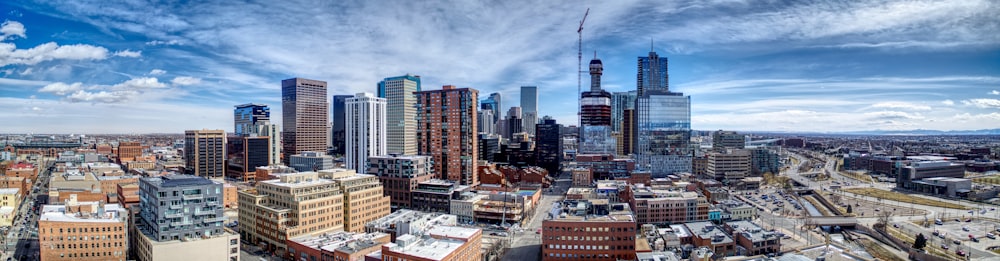 city buildings under cloudy sky during daytime