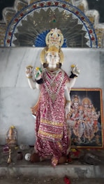 Front view of Vadakkumpuram Sree Vishnumaya Temple showcasing the north-facing deity in Kubera posture.
