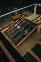 An assortment of luxury watches arranged in a neat layout.