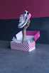 person holding white and red heart print box