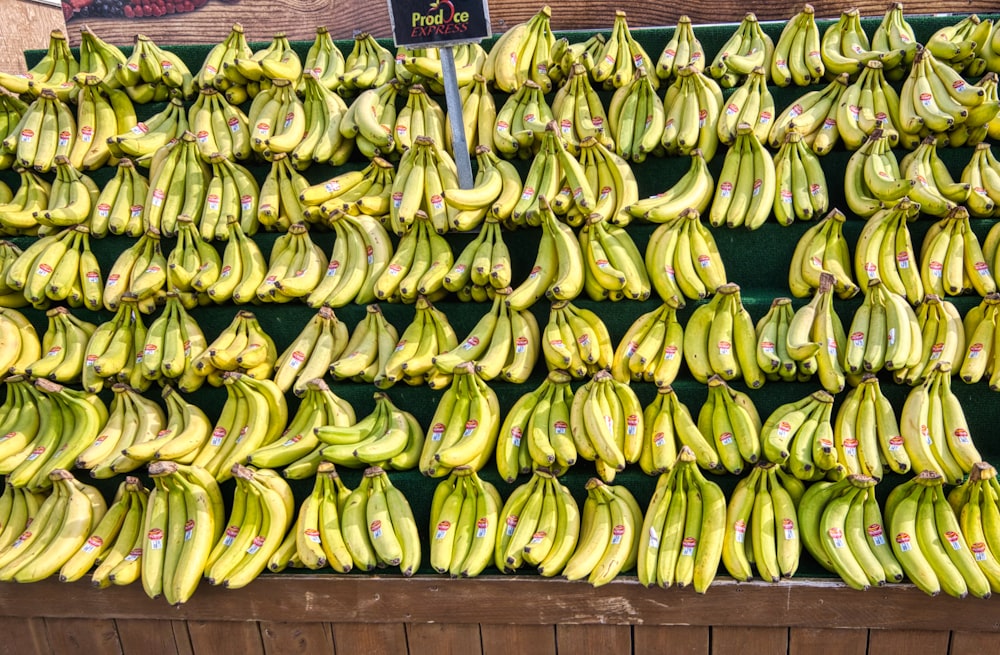 green banana fruit on brown wooden table