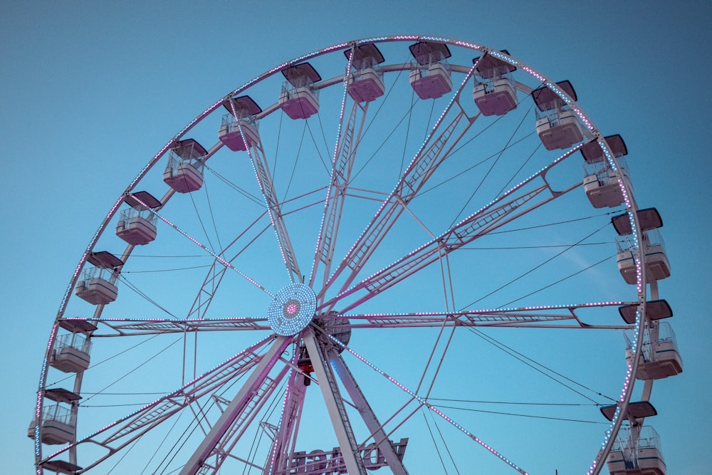 white and red ferris wheel under blue sky during daytime