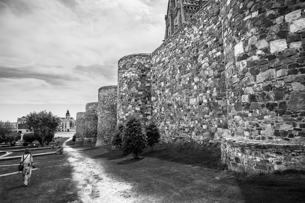 grayscale photo of brick building