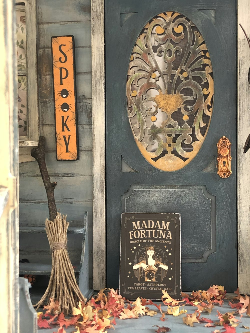 brown broom stick on black wooden door