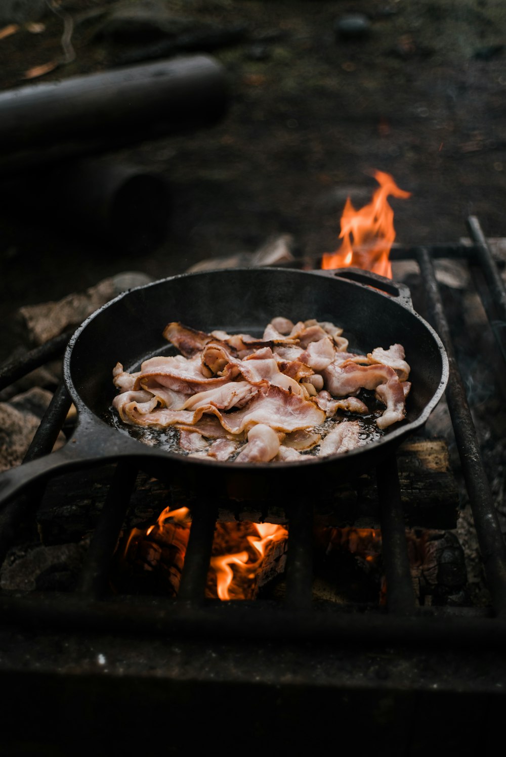 black cast iron pan with fire