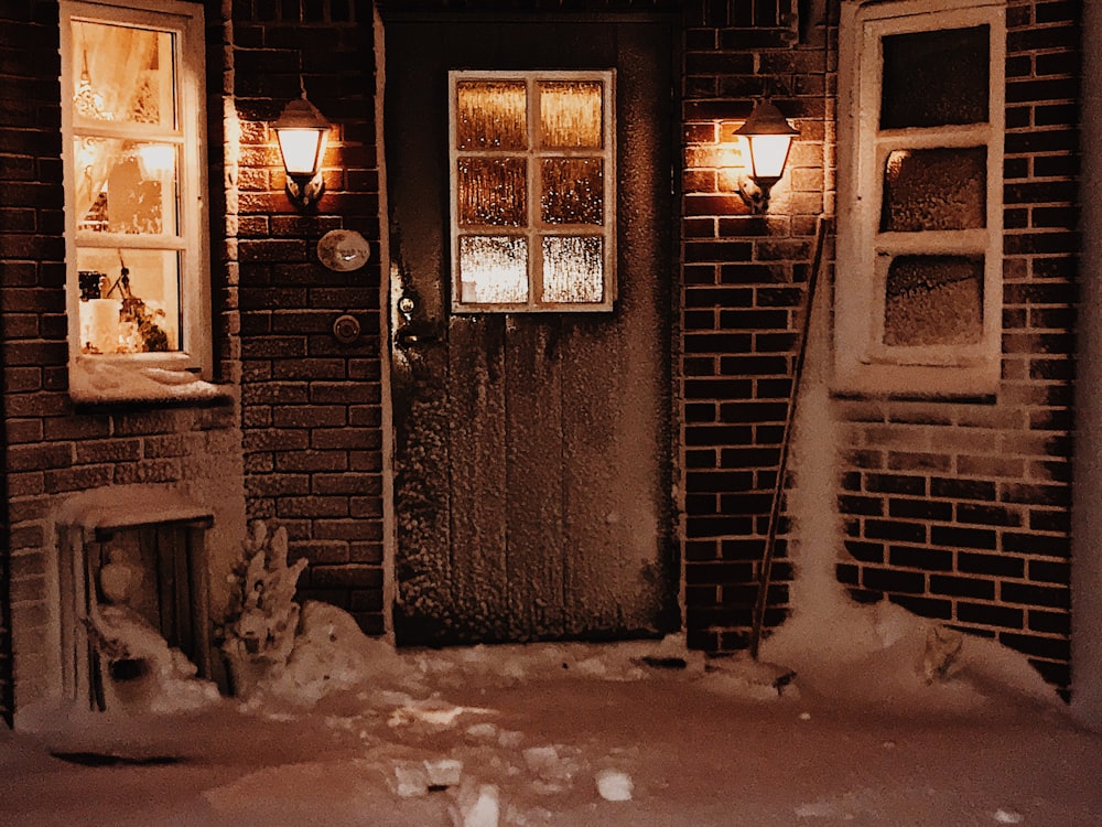 black metal door with snow on top