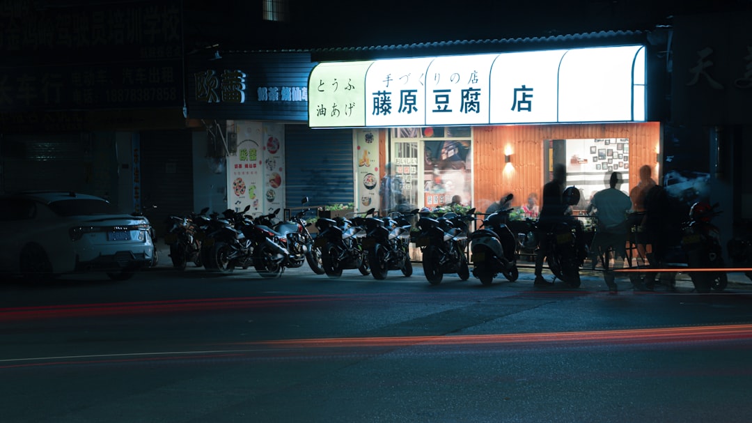 motorcycle parked in front of store