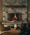 Cozy fireplace corner inside a hotel room creating a warm ambiance.
