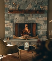 A warm fireplace surrounded by comfortable seating.