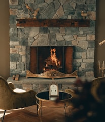 A cozy fireplace corner inside the heritage suite, inviting and warm.