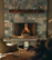 Couple relaxing by the elegant hotel lobby fireplace at Luminara.